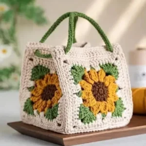 Handmade crochet sunflower handbag with granny square design in cream, yellow and green colors