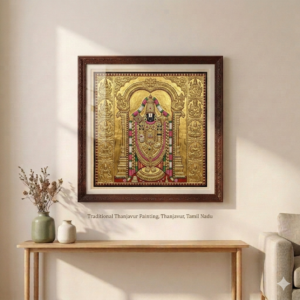 Handcrafted Tanjore painting with gold foil detailing and traditional deity artwork in decorative frame