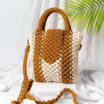 Handwoven crochet cotton handbag in mustard and white with shoulder strap and boho design