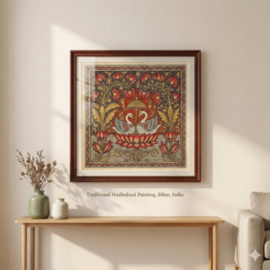 Handcrafted Madhubani painting with traditional floral and swan motifs in wooden frame displayed on wall